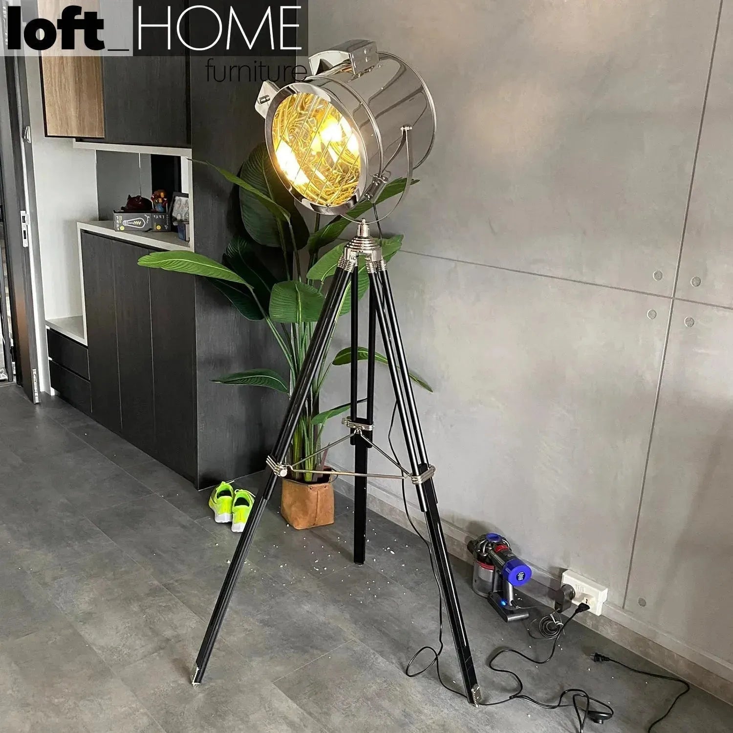 Industrial metal floor lamp tripod in panoramic view.