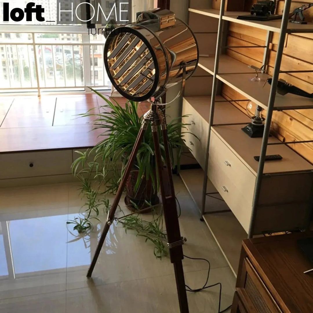 Industrial metal floor lamp tripod in close up details.