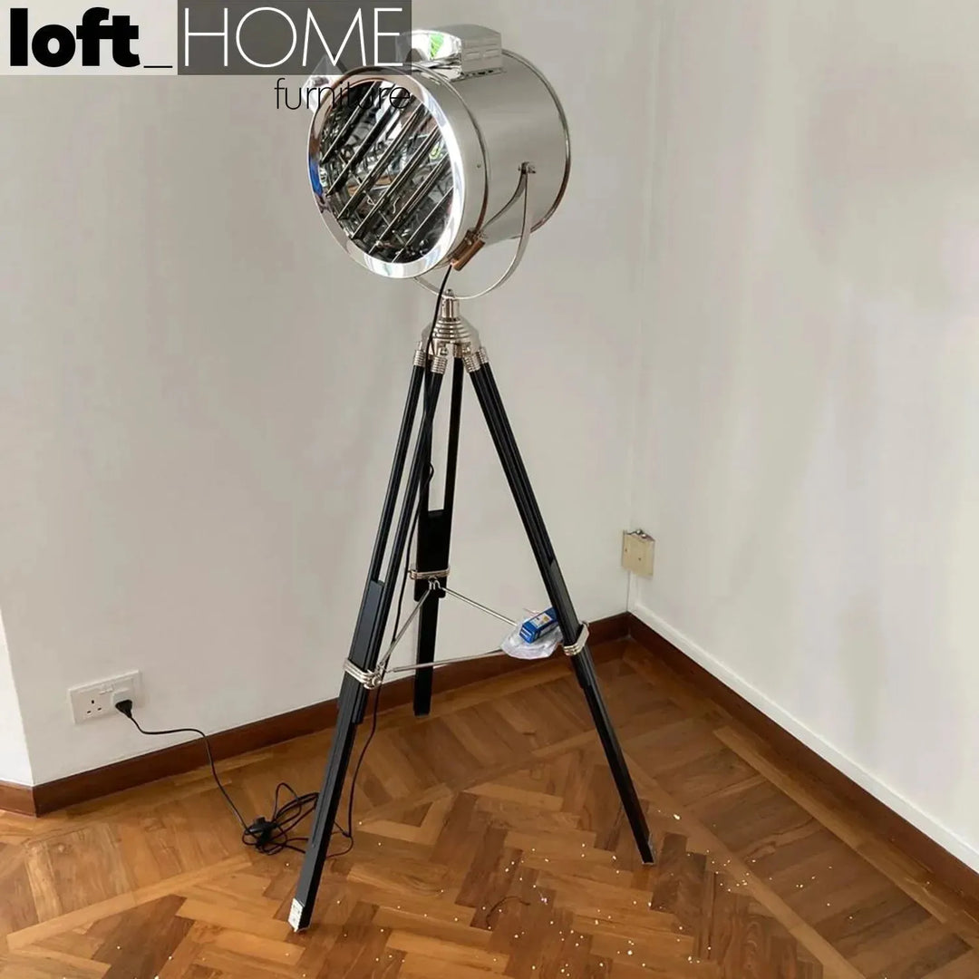Industrial metal floor lamp tripod in still life.