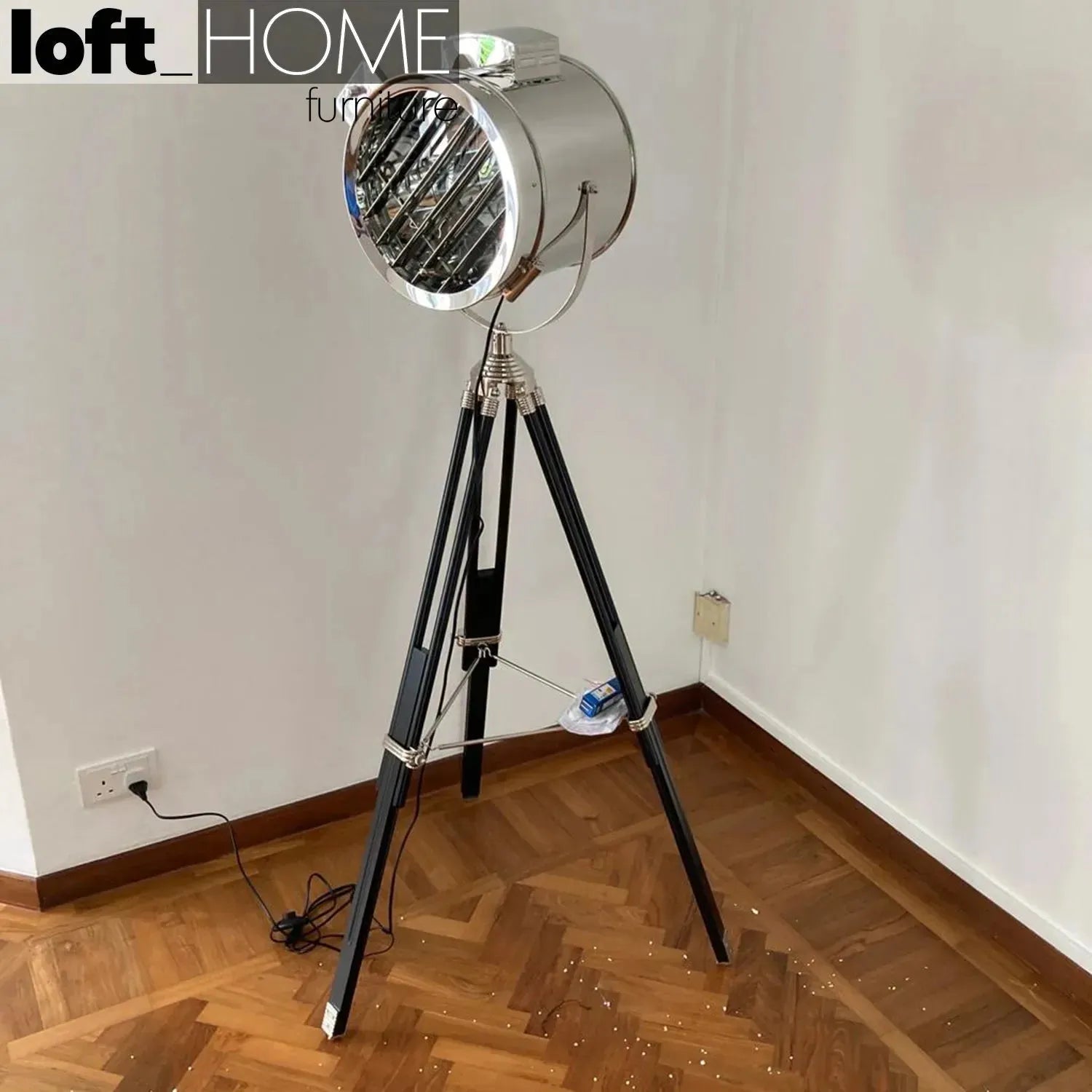Industrial metal floor lamp tripod in still life.