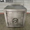 Industrial metal side table hatch wheel in panoramic view.