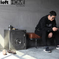 Industrial metal side table hatch wheel in real life style.