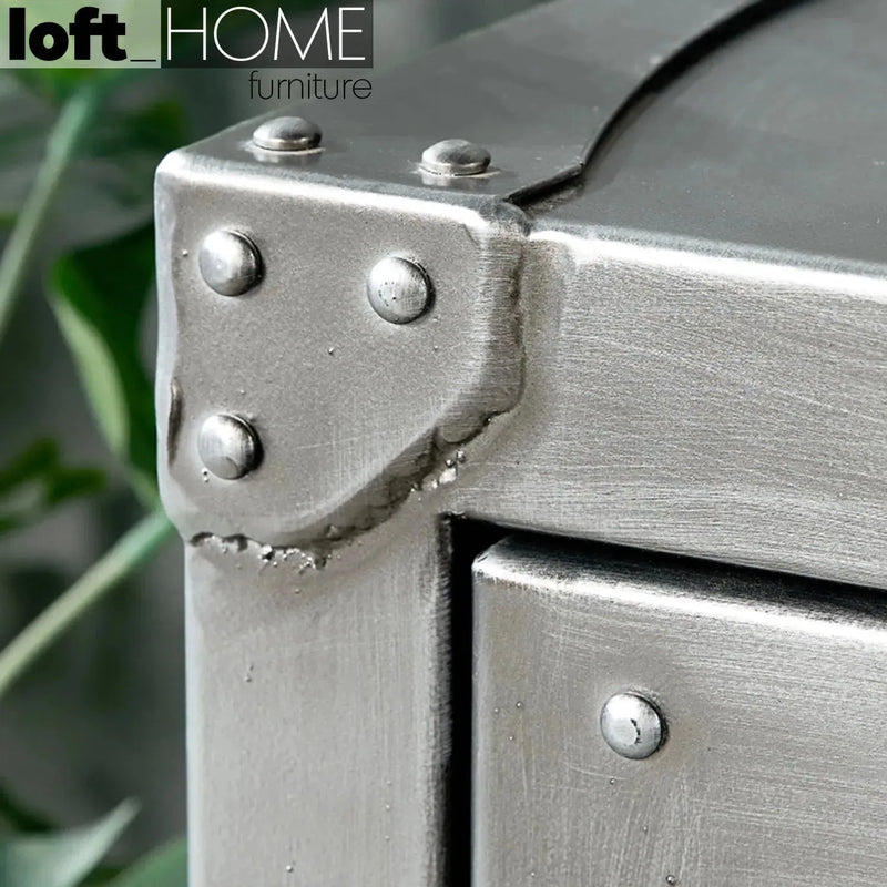 Industrial metal side table hatch wheel in details.