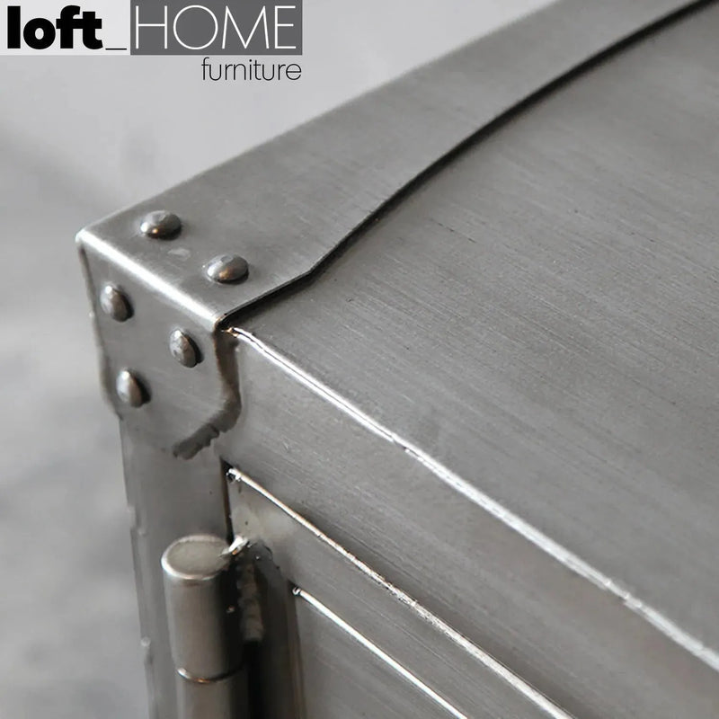 Industrial metal tv console hatch wheel in panoramic view.