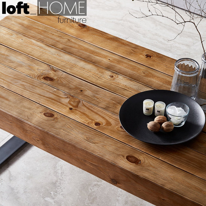 Industrial pine wood dining table noer in close up details.