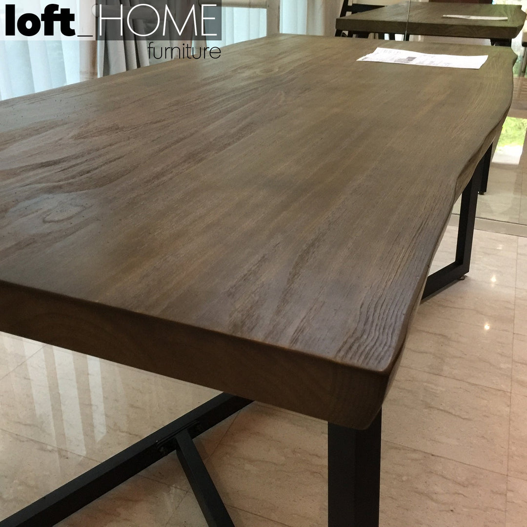 Industrial pine wood live edge dining table designer in panoramic view.