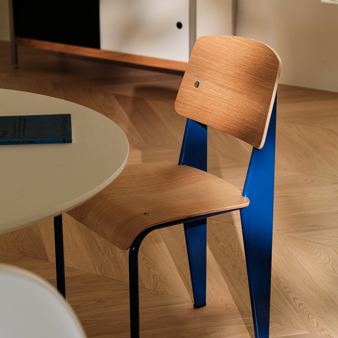 Industrial plywood dining chair standard with context.