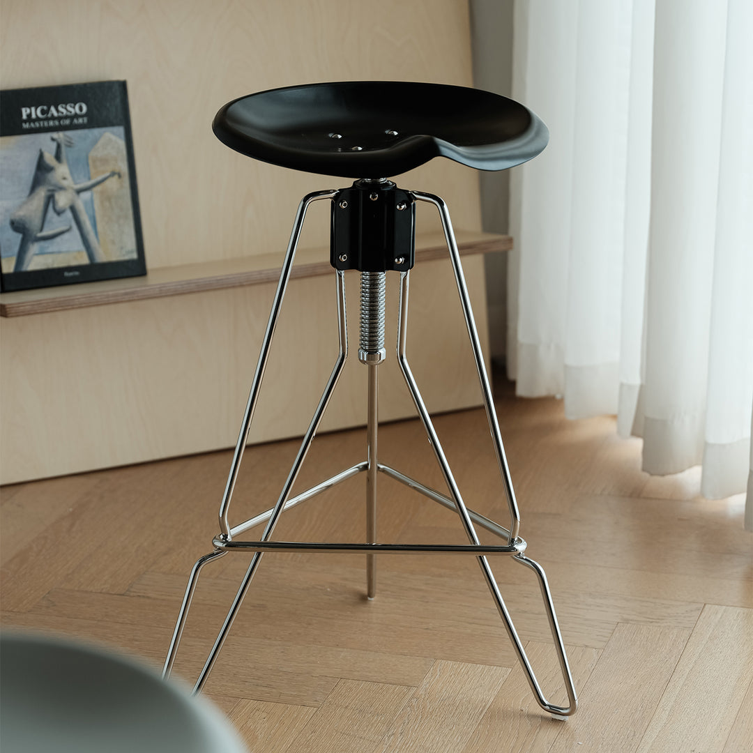 Industrial steel height adjustable bar chair spool in real life style.