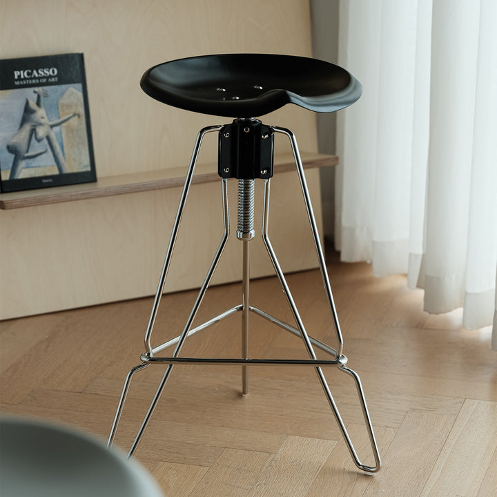 Industrial steel height adjustable bar chair spool in real life style.