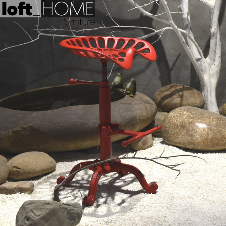 Industrial steel height adjustable stool dewy with context.