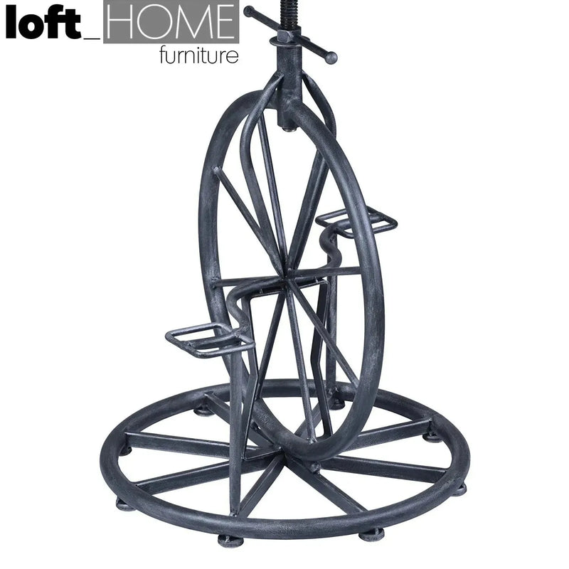 Industrial wood height adjustable bar stool bike in real life style.