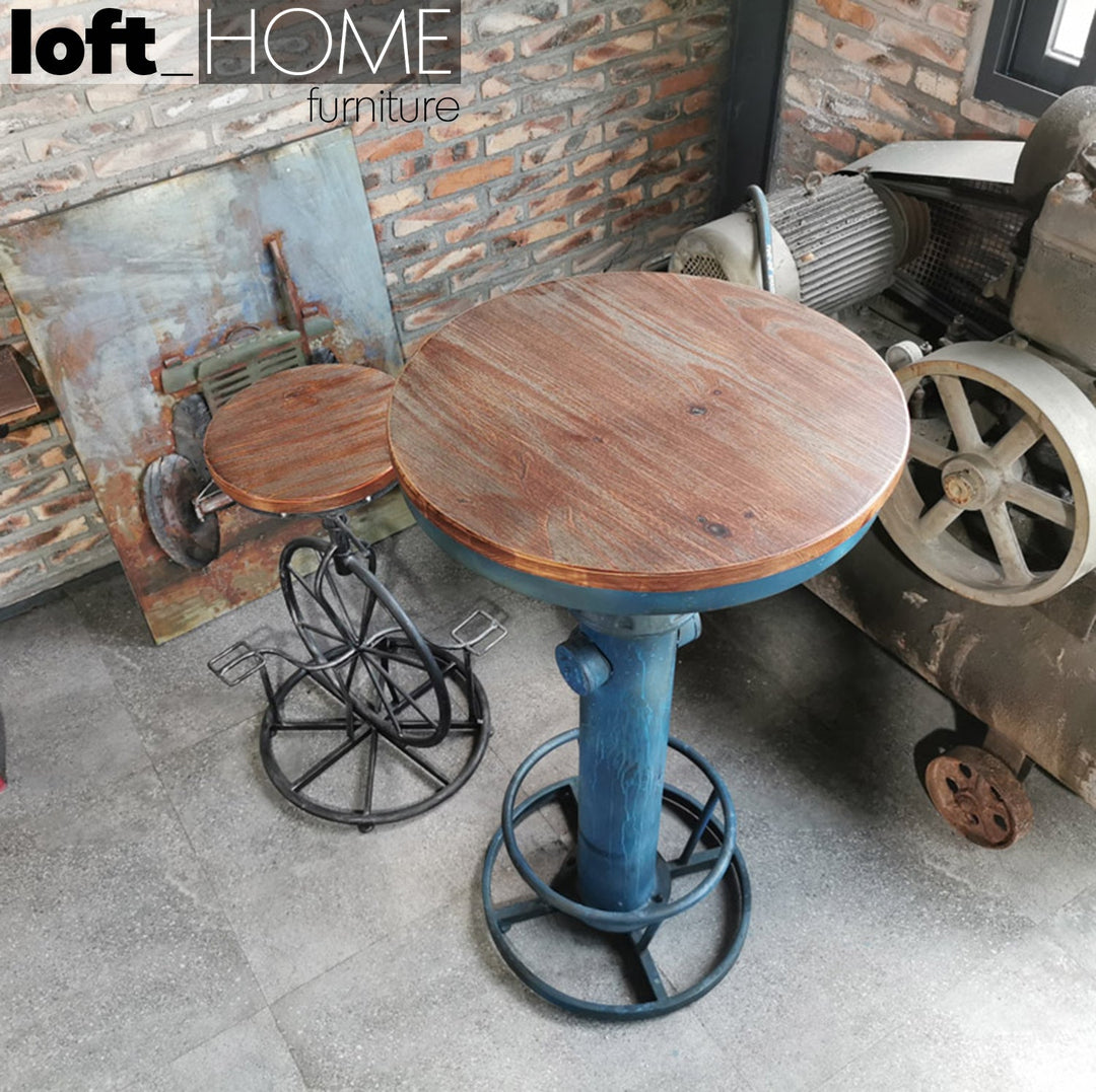 Industrial wood height adjustable bar stool bike with context.