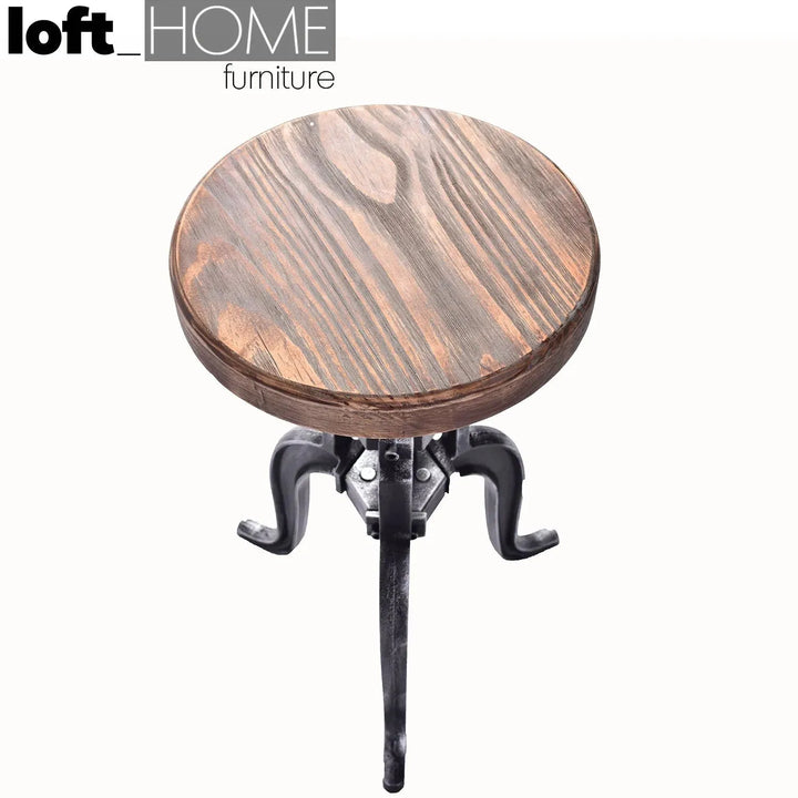 Industrial wood height adjustable stool crank in real life style.