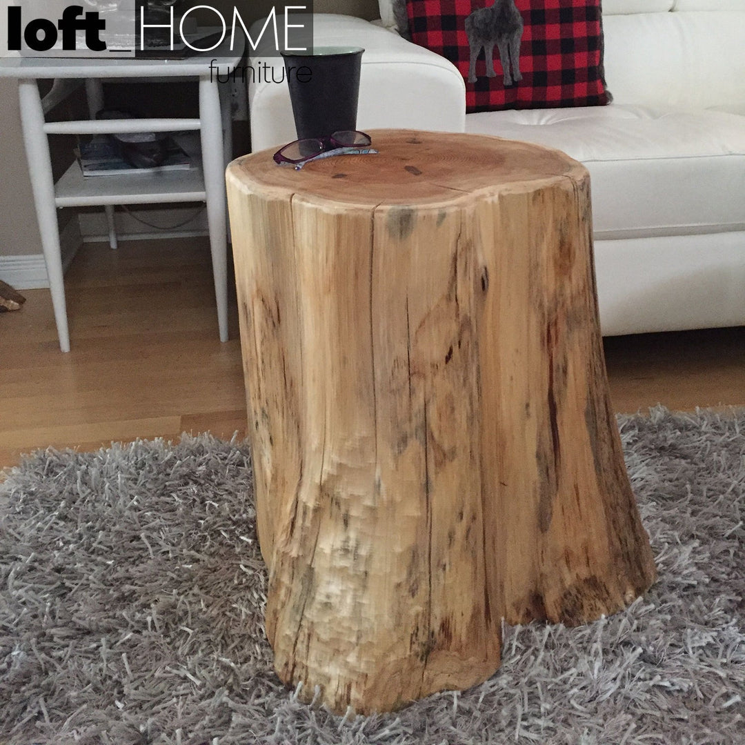 Industrial wood side table stump in real life style.