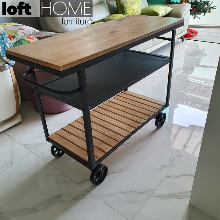 Industrial wood side table trolley in panoramic view.