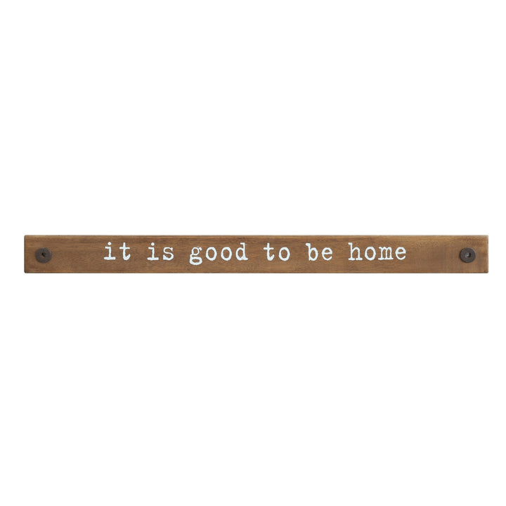 "it is good to be home" wood wall decor in white background.