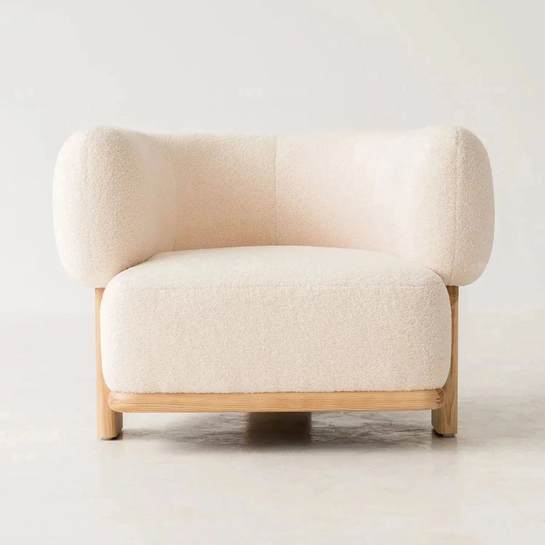 Cream boucle fabric 1 seater sofa chubby in details.