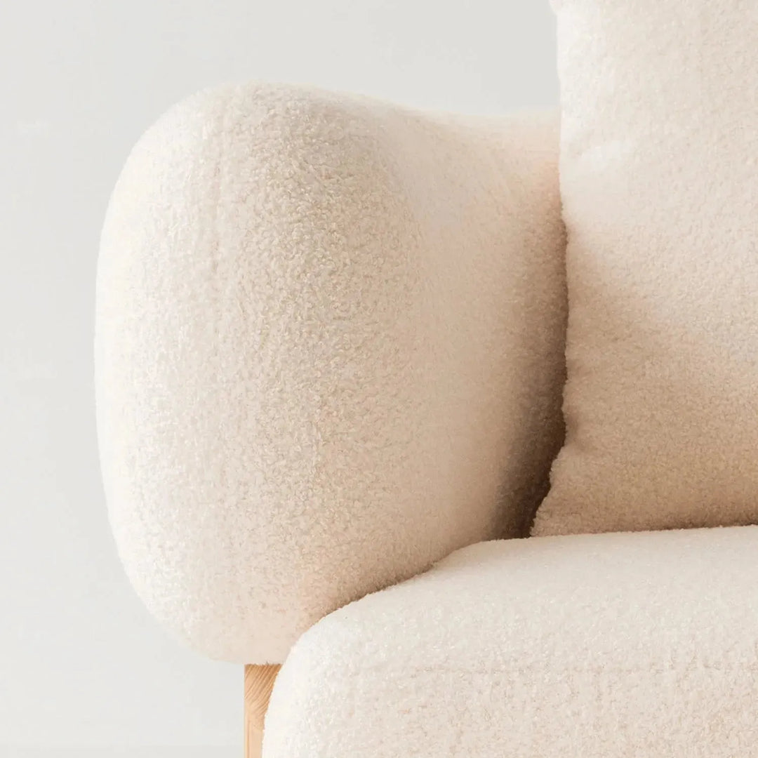 Cream boucle fabric 1 seater sofa chubby in still life.
