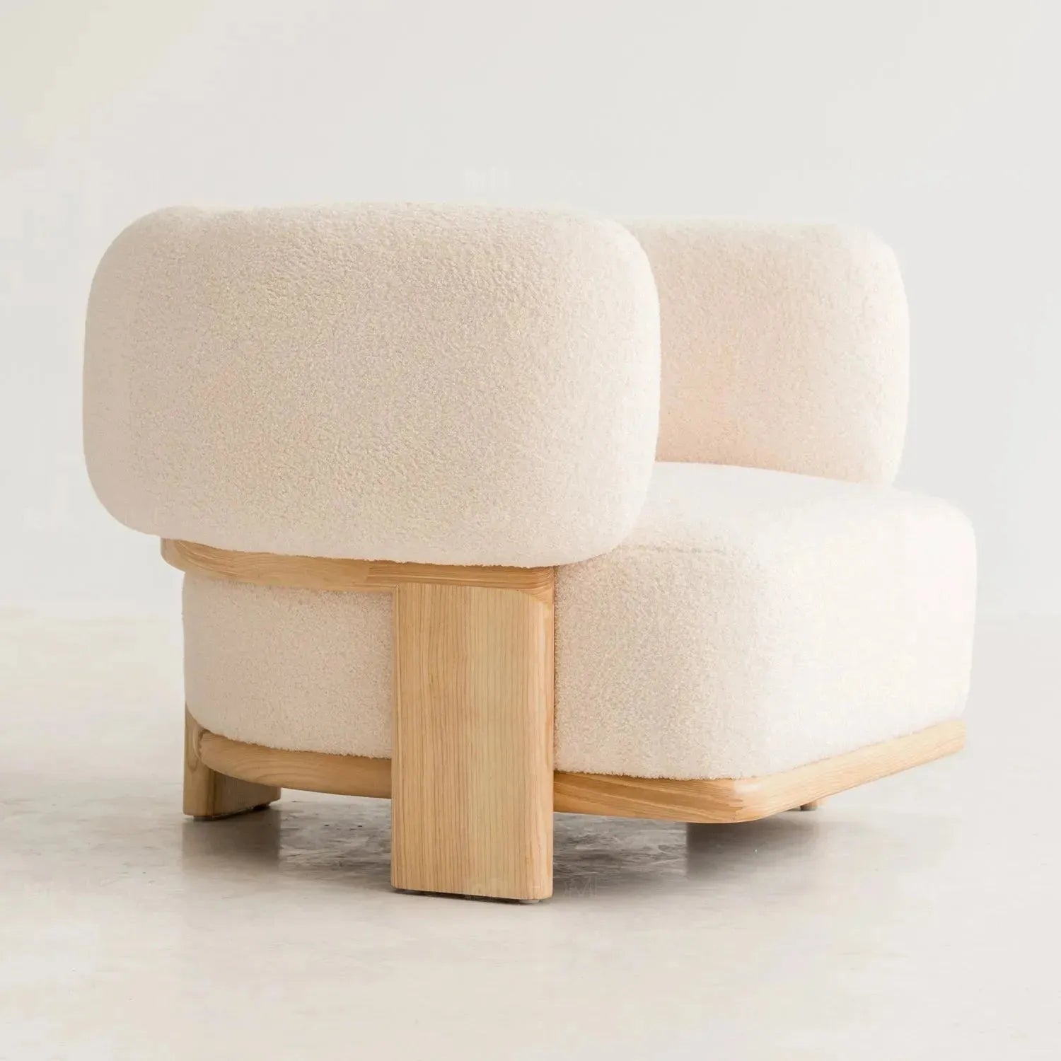 Cream boucle fabric 1 seater sofa chubby with context.