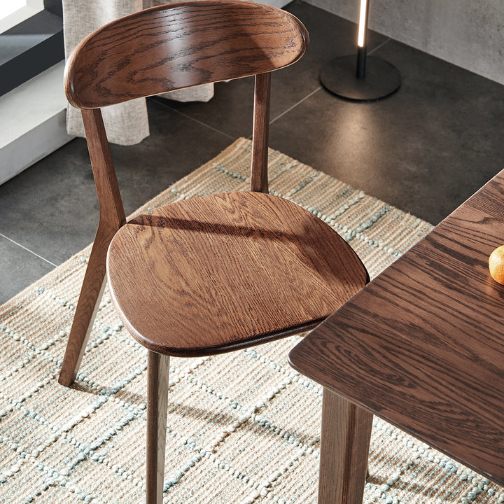 Japandi oak wood dining chair elm walnut in close up details.