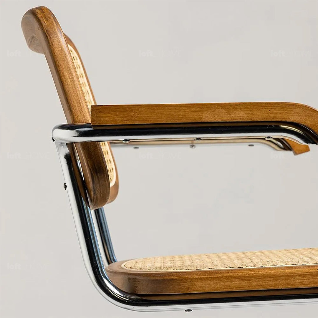 Japandi rattan armrest dining chair cesca in close up details.