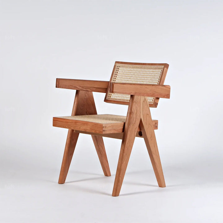 Japandi rattan armrest dining chair jeanneret in panoramic view.