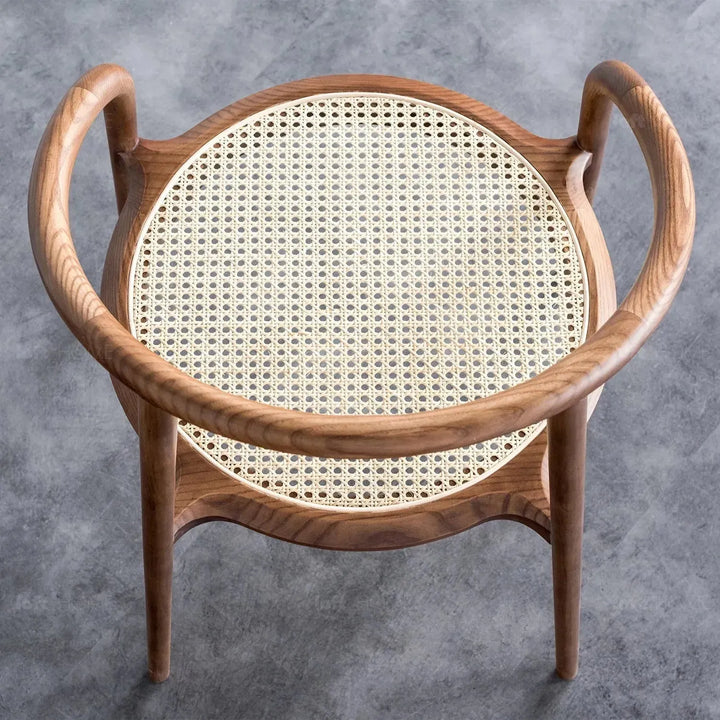 Japandi rattan dining chair circular in close up details.