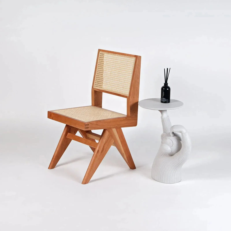 Scandinavian rattan dining chair jeanneret in still life.