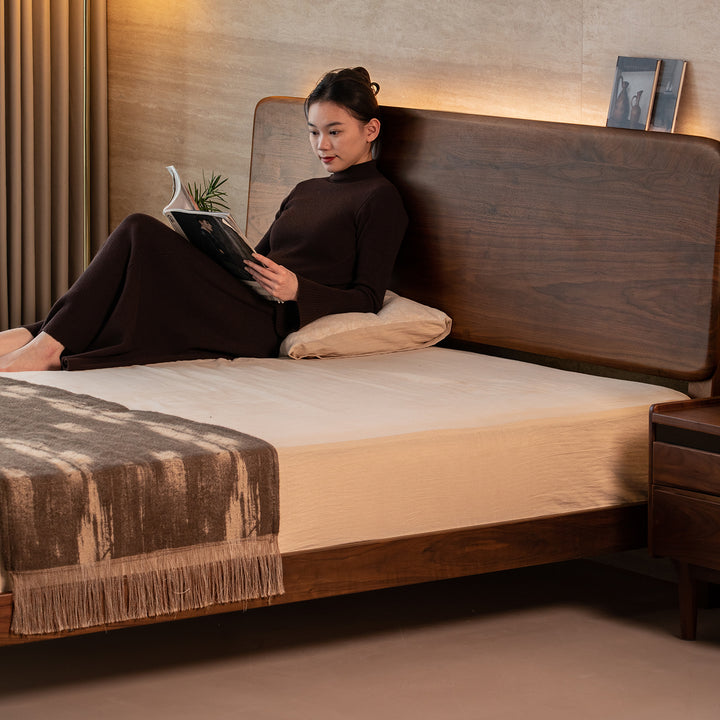 Japandi walnut wood bed dune in close up details.