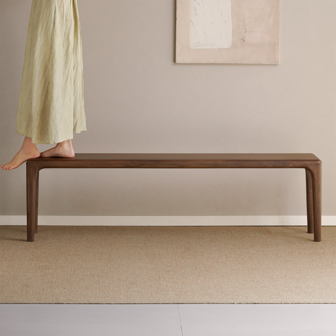 Japandi walnut wood dining bench conti with context.