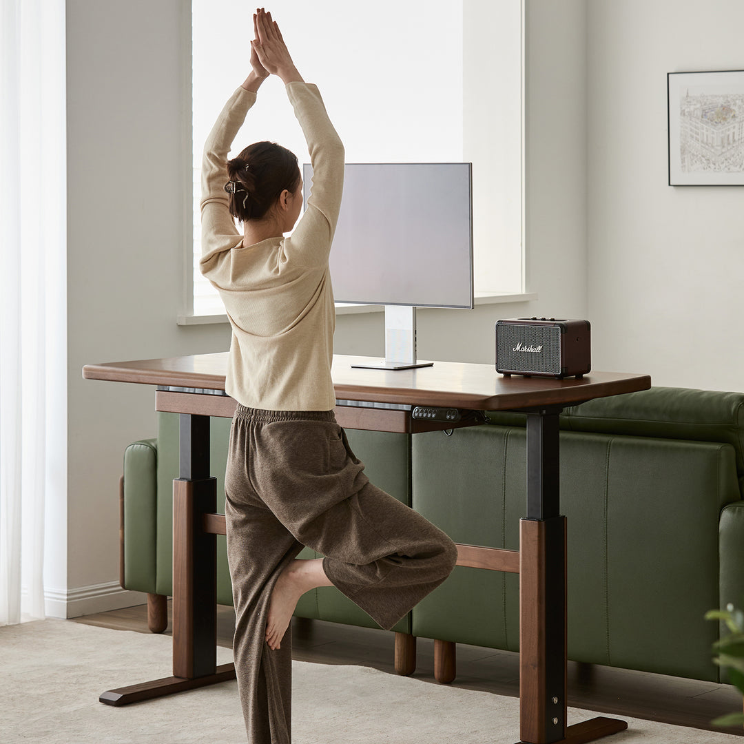 Japandi walnut wood electric height adjustable study table cloud lifting in still life.
