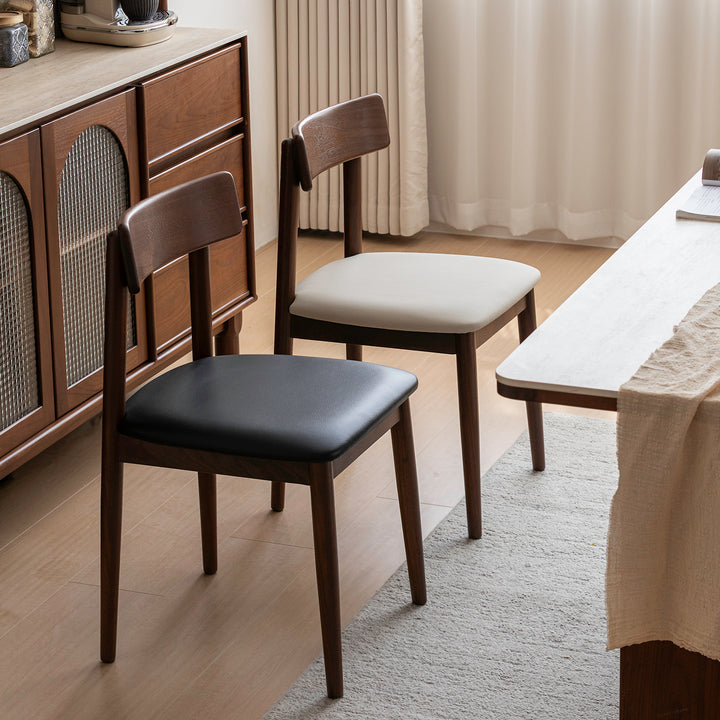 Japandi walnut wood microfiber leather dining chair green primary product view.