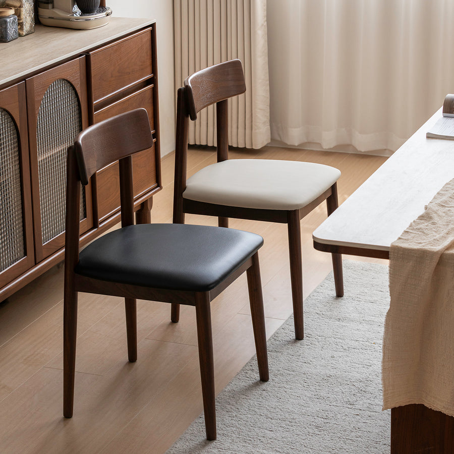Japandi walnut wood microfiber leather dining chair green primary product view.