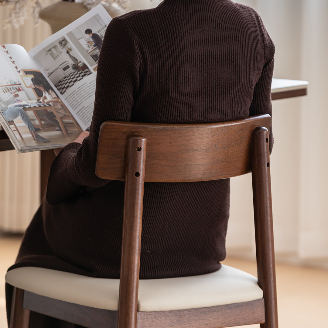Japandi walnut wood microfiber leather dining chair green environmental situation.