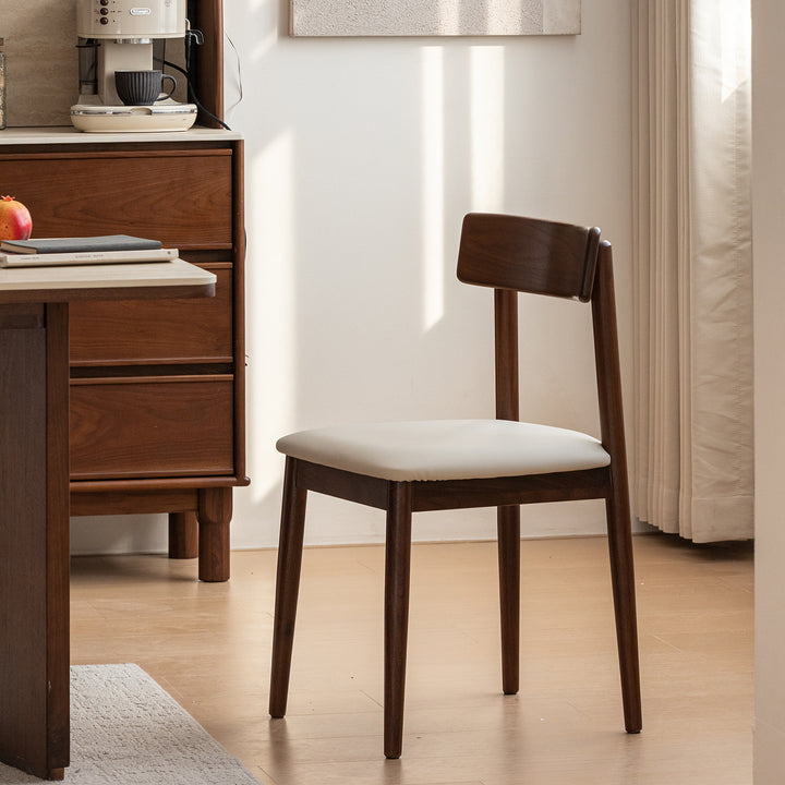 Japandi walnut wood microfiber leather dining chair green in details.
