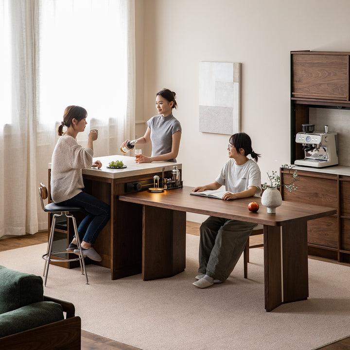 Japandi walnut wood sintered stone island dining table with cabinet axis material variants.
