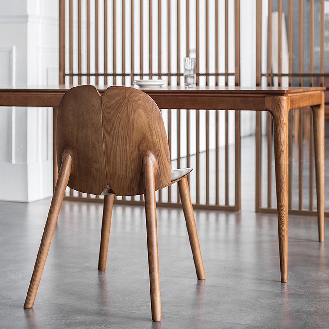 Japandi wood dining chair pulp in panoramic view.