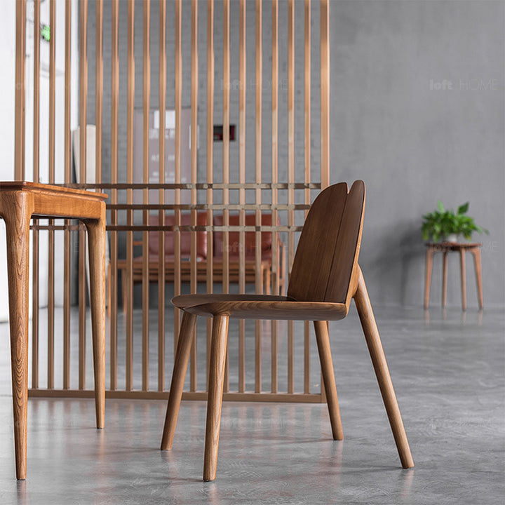 Japandi wood dining chair pulp with context.