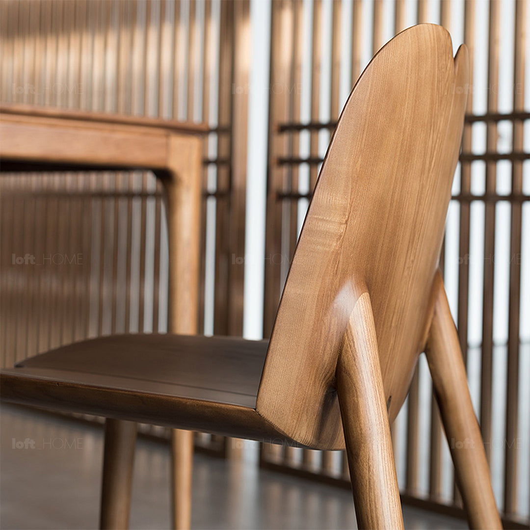 Japandi wood dining chair pulp layered structure.