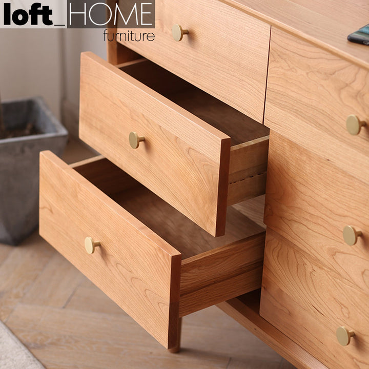 Japandi wood drawer cabinet cherry 9 drawers in close up details.