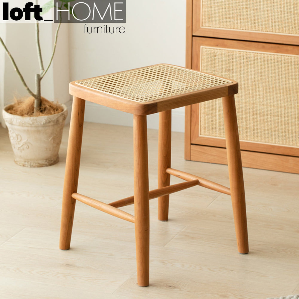 Japandi wood stool cherry rattan primary product view.