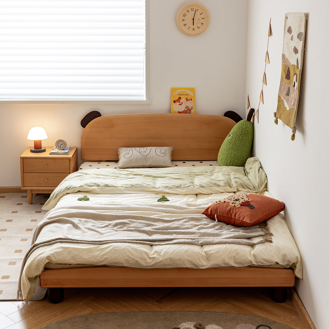 Scandinavian beech wood kids bed teddy in still life.