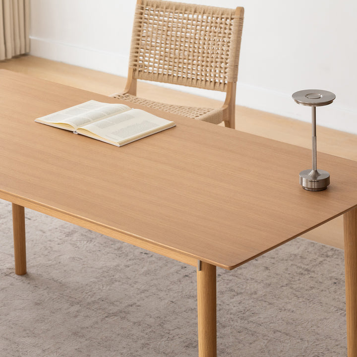 Minimalist ash wood dining table borel in close up details.