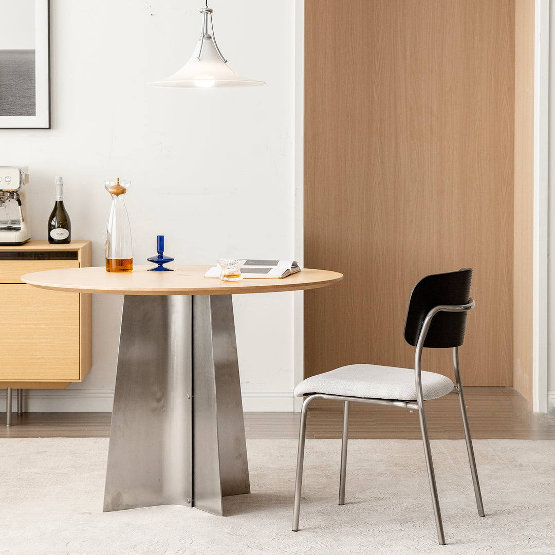 Minimalist ash wood veneer cotton fabric dining chair black aeri in close up details.