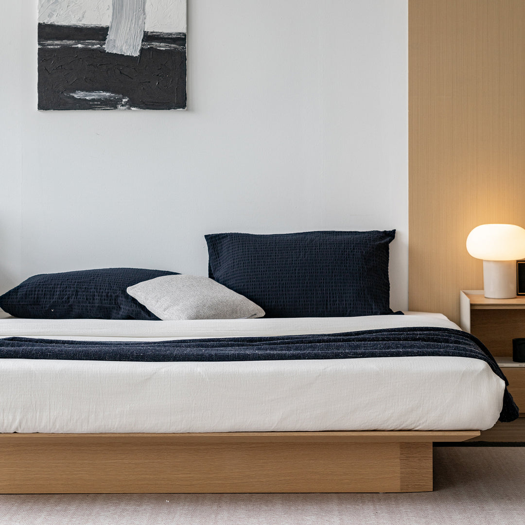 Minimalist ash wood veneer platform floating bed winter in close up details.