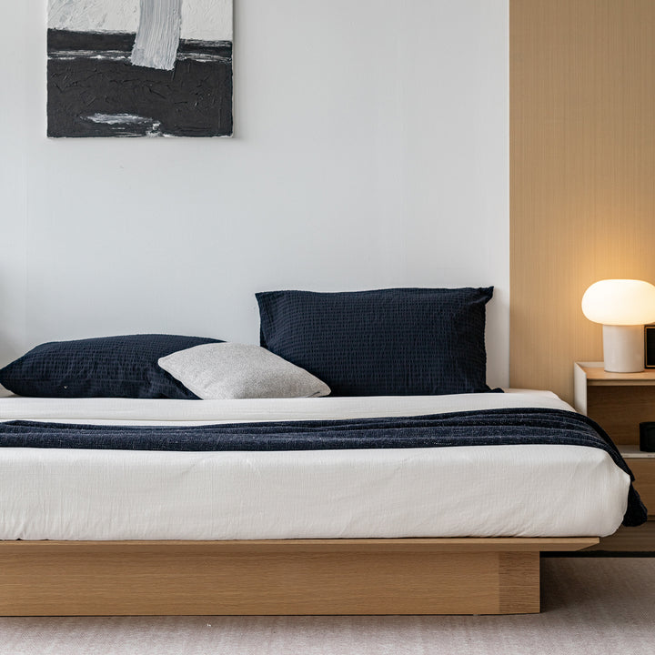 Minimalist ash wood veneer platform floating bed winter in close up details.