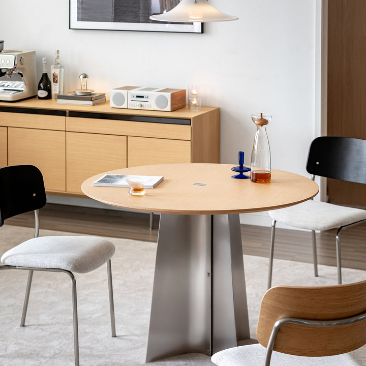 Minimalist ash wood veneer stainless steel round dining table aeri primary product view.