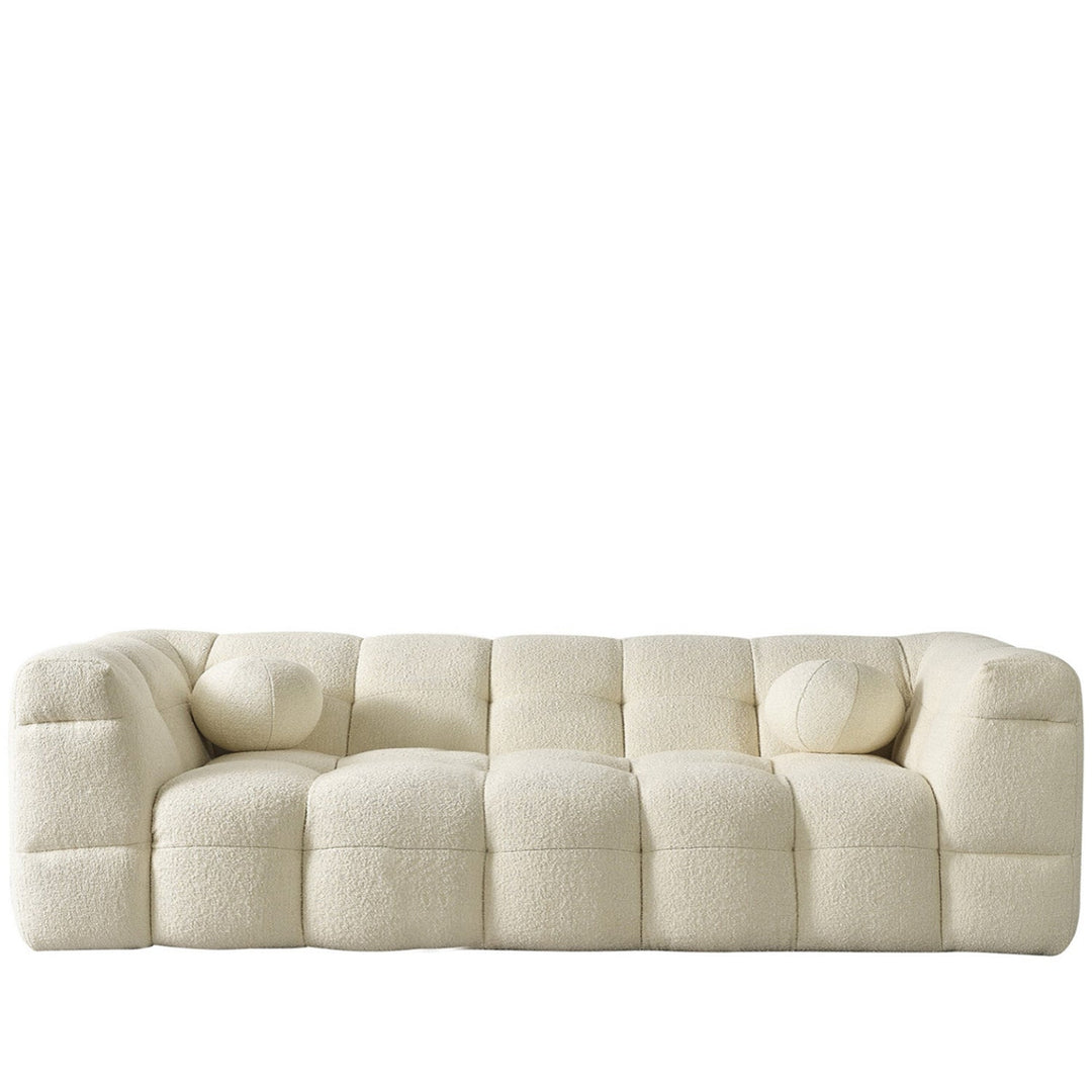 Minimalist boucle fabric 3 seater sofa boba in white background.