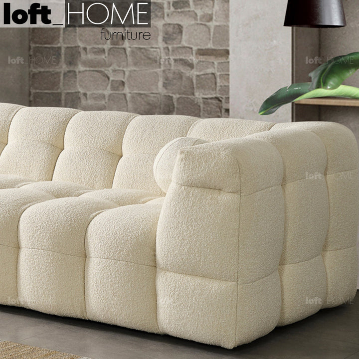 Minimalist boucle fabric 3 seater sofa boba in panoramic view.