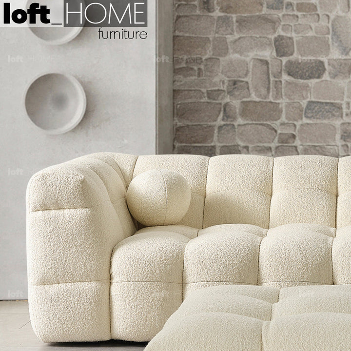 Minimalist boucle fabric 3 seater sofa boba in close up details.